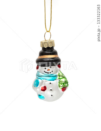Glass snowman Christmas tree ornament with colorful details, hanging on a string, isolated on white. Glass snowman Christmas tree ornament with colorful details, hanging on a string, isolated on white. 133322163