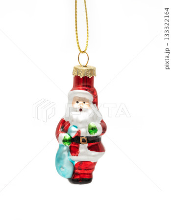 Glass Santa Christmas tree ornament hanging on a string, isolated on a white background. Glass Santa Christmas tree ornament hanging on a string, isolated on a white background. 133322164