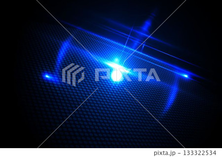 Glowing blue dot on black background 133322534