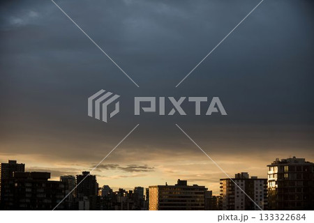 City against cloudy sky during sunset 133322684