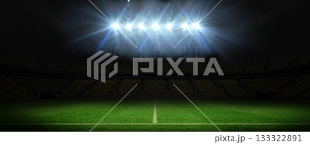 Showing football pitch at night in flat style, floodlights casting light onto grass centerline 133322891
