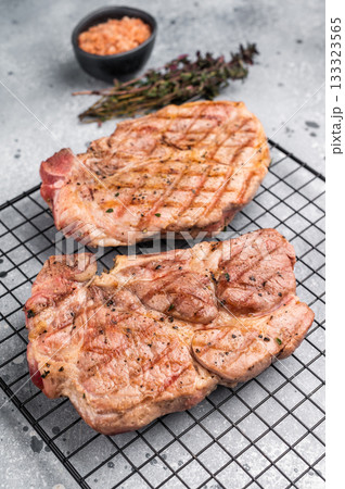 Grilled pork neck steaks, fillet meat. grey background. top view 133323565