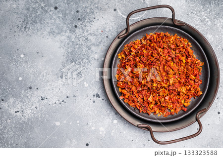 Dried Tomato Flakes, Indian and Arabic spices for cooking. grey background. top view 133323588