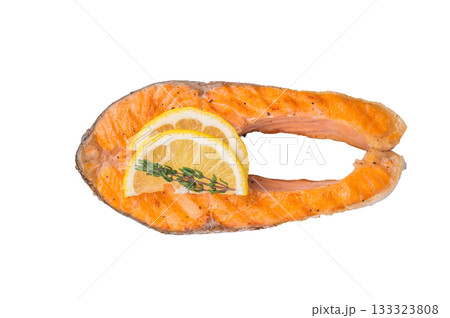 Grilled salmon steak on a clean white background highlighting its warm orange tones and texture for a bright minimalist food presentation. 133323808