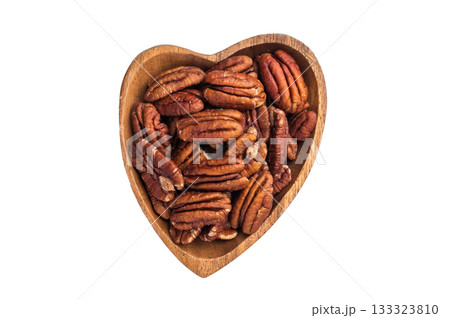 Shelled pecan nuts in a wooden bowl on a clean white background creating a simple natural ingredient shot ideal for culinary and healthy food themes 133323810