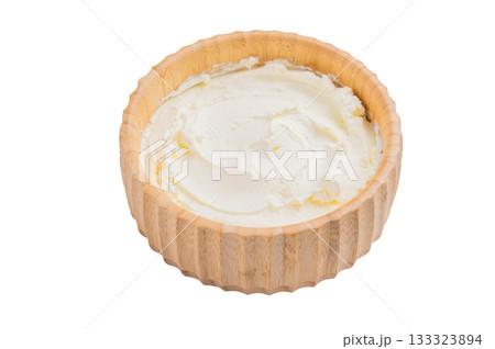 Cream texture, Mascarpone Italian cream cheese in wooden bowl isolated on white background. top view Cream texture, Mascarpone Italian cream cheese in wooden bowl isolated on white background. top view 133323894