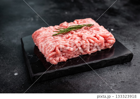 Raw ground pork meat, mincemeat. black background. top view 133323918