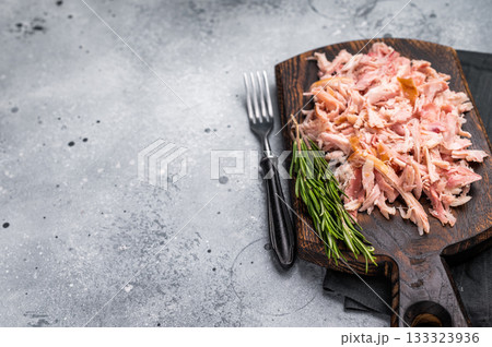 Shredded or Pulled Chicken meat on wooden board. grey background. top view 133323936