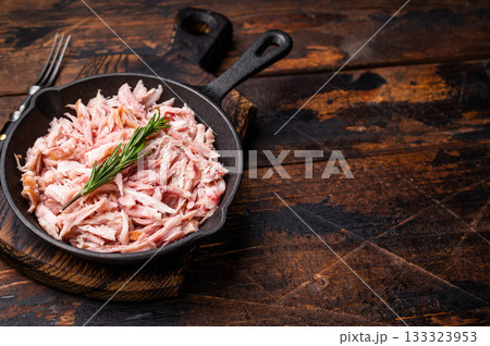 BBQ smoked Pulled Chicken meat in a skillet. wooden background. top view BBQ smoked Pulled Chicken meat in a skillet. wooden background. top view 133323953