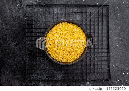 Healthy raw dry Millet flakes for porridge and muesli. black background. top view 133323960