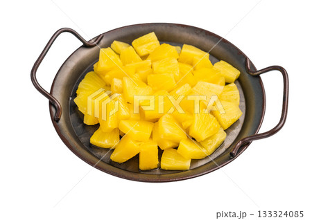 Canned Pineapple chunks slices in a bowl isolated on white background. top view 133324085