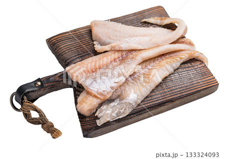 fresh Raw Pollock fish fillets on a wooden board with herbs isolated on white background. top view fresh Raw Pollock fish fillets on a wooden board with herbs isolated on white background. top view 133324093