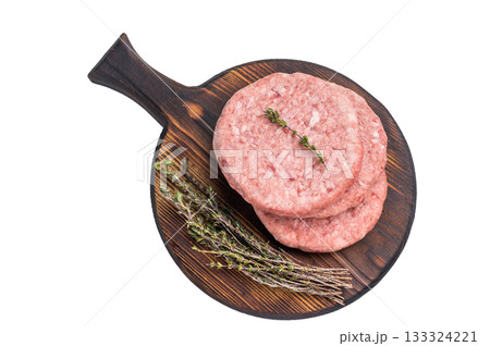 Uncooked beef and pork meat patty on a wooden board, inviting you to create your favorite gourmet burger recipes. isolated on white background. top view Uncooked beef and pork meat patty on a wooden board, inviting you to create your favorite gourmet burger recipes. isolated on white background. top view 133324221