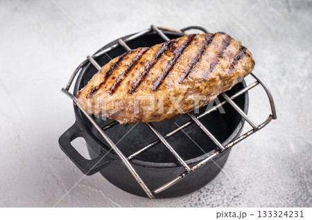 Delicious kofta kebabs sizzling on the grill, infused with aromatic spices for a mouthwatering culinary experience.. white background. top view 133324231
