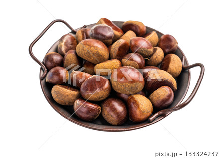 Heap of fresh chestnuts in kitchen tray ready for roasting isolated on white background 133324237