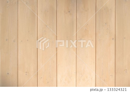 Vertical light-colored wooden planks are creating flat design backdrop showing subtle grain details 133324321