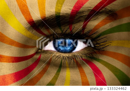 Blue eye on patterned face 133324462