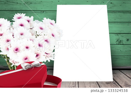 Flowers and present box on wooden background 133324538