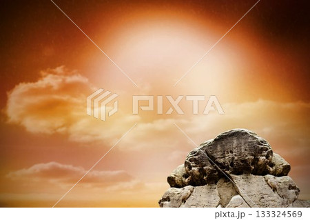 Large rock overlooking orange sky Large rock overlooking orange sky 133324569