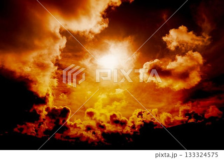Bright sun is breaking through dramatic orange clouds in flat design sky with silhouetted horizon 133324575