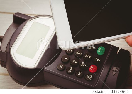 Man using smartphone to express pay Man using smartphone to express pay 133324660