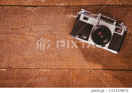 Old school camera on wooden floor Old school camera on wooden floor 133324672