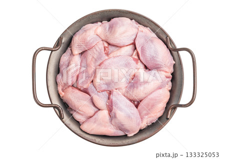 Fresh raw quail breasts (skin-on) arranged in a round metal pan, isolated on a white background. Ready for cooking. 133325053