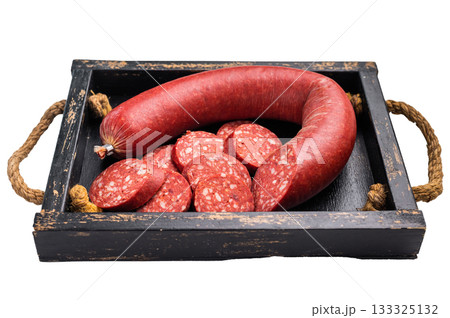 Whole and sliced Turkish sucuk (sujuk) on a rustic cutting board. Traditional spicy dry-cured sausage. Whole and sliced Turkish sucuk (sujuk) on a rustic cutting board. Traditional spicy dry-cured sausage. 133325132