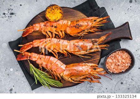 Seafood Skewers with Grilled red Argentine shrimps, Prawns Langostino Austral. grey background. top view 133325134