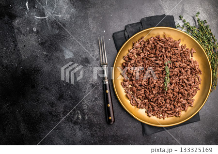 Roast and Fried mince meat, fresh cooked ground meat in a plate. black background. top view Roast and Fried mince meat, fresh cooked ground meat in a plate. black background. top view 133325169