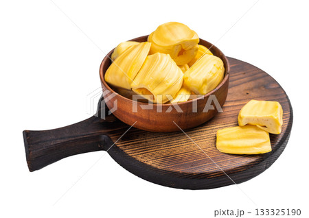 Sweet, golden jackfruit pods (bulbs) served in a rustic wooden bowl on a dark cutting board. Fresh, tropical fruit dessert or snack. Sweet, golden jackfruit pods (bulbs) served in a rustic wooden bowl on a dark cutting board. Fresh, tropical fruit dessert or snack. 133325190