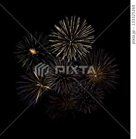 Fireworks of various colors and shapes burst in night sky 133325268