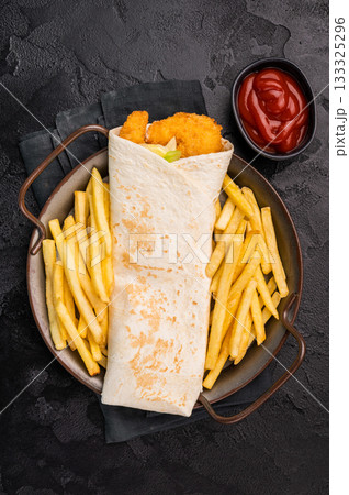 Seafood Wrap, Doner kebab with shrimps, prawns and salad. black background. top view Seafood Wrap, Doner kebab with shrimps, prawns and salad. black background. top view 133325296