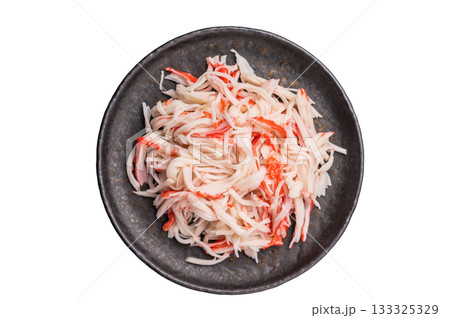 Crab meat, crabmeat imitation on a plate isolated on the white background. top view 133325329