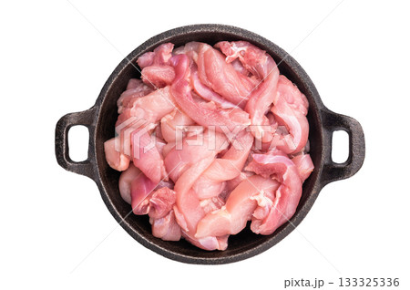 Raw Chicken sliced thighs fillets in a skillet isolated on white background Raw Chicken sliced thighs fillets in a skillet isolated on white background 133325336