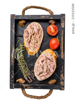 Gourmet style tuna sandwich with fresh herbs and spices, elevating your lunchtime experience to the next level. isolated on white background. top view Gourmet style tuna sandwich with fresh herbs and spices, elevating your lunchtime experience to the next level. isolated on white background. top view 133325509