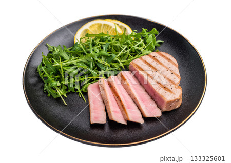 Succulent grilled tuna steak, showcasing vibrant color and rich taste, perfect for summer barbecues and elegant dinners. isolated on white background. top view Succulent grilled tuna steak, showcasing vibrant color and rich taste, perfect for summer barbecues and elegant dinners. isolated on white background. top view 133325601