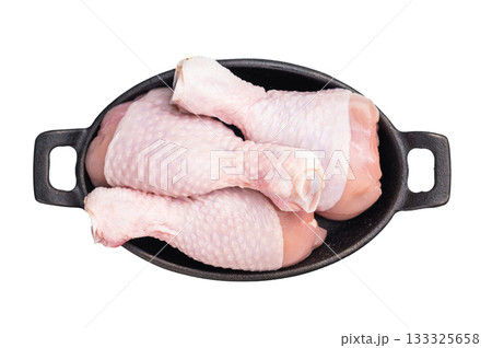 Raw chicken legs drumsticks, perfect for roasting or frying, offering a delicious and juicy flavor in every bite. isolated on white background. top view Raw chicken legs drumsticks, perfect for roasting or frying, offering a delicious and juicy flavor in every bite. isolated on white background. top view 133325658
