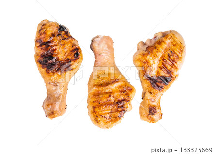 Juicy grilled chicken drumsticks, perfectly charred and bursting with flavor, ideal for a summer barbecue. isolated on white background. top view Juicy grilled chicken drumsticks, perfectly charred and bursting with flavor, ideal for a summer barbecue. isolated on white background. top view 133325669