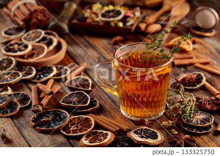 Herbal tea with thyme and dried citrus. 133325750