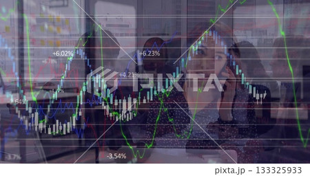 Talking woman holding smartphone at laptops by glass partition, stock chart overlay, copy space Talking woman holding smartphone at laptops by glass partition, stock chart overlay, copy space 133325933