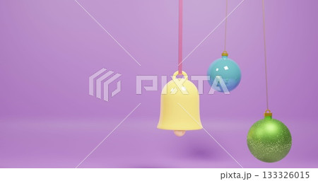 Hanging three ornaments on purple set showing yellow bell, blue bauble, green glitter, copy space Hanging three ornaments on purple set showing yellow bell, blue bauble, green glitter, copy space 133326015