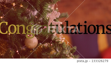 Showing branch glowing at home with lights, gold baubles, tinsel, gingerbread ornament, copy space Showing branch glowing at home with lights, gold baubles, tinsel, gingerbread ornament, copy space 133326279