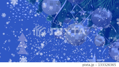 Displaying pine branch with silver baubles and ribbons on blue backdrop, snowflakes copy space Displaying pine branch with silver baubles and ribbons on blue backdrop, snowflakes copy space 133326365