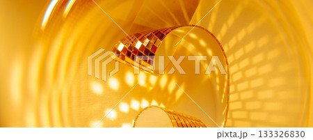 Abstract sparkling golden panoramic banner background with spirals and reflections. Designed for holiday sales Christmas and New Year campaigns. Abstract sparkling golden panoramic banner background with spirals and reflections. Designed for holiday sales Christmas and New Year campaigns. 133326830