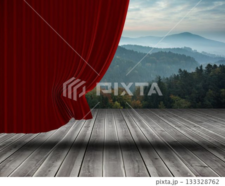 Red velvet curtain is framing forested hills and mountains over wooden stage floor, flat design Red velvet curtain is framing forested hills and mountains over wooden stage floor, flat design 133328762