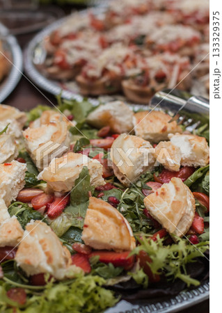Wedding catering showing goat cheese salad and bruschetta appetizers Wedding catering showing goat cheese salad and bruschetta appetizers 133329375