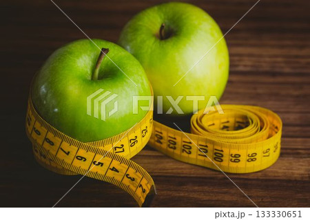 Green apples and measuring tape Green apples and measuring tape 133330651