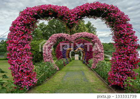 Summer garden heart-shaped flower arches decorate Pakruojis minor in Lithuania Summer garden heart-shaped flower arches decorate Pakruojis minor in Lithuania 133331739