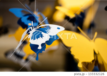 ceiling decorated with decorative colored paper butterflies, selective focus, blurred background ceiling decorated with decorative colored paper butterflies, selective focus, blurred background 133332126